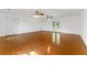 Open living space featuring gleaming hardwood floors, neutral walls, and double doors to the outside providing a bright atmosphere at 1170 Moseley Rd, Stockbridge, GA 30281
