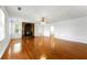 Bright living room featuring hardwood floors and a charming stone fireplace offering a cozy ambiance at 1170 Moseley Rd, Stockbridge, GA 30281