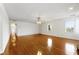 Spacious living room featuring hardwood floors and ample natural light creating a bright and inviting space at 1170 Moseley Rd, Stockbridge, GA 30281