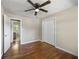 Bedroom with hardwood flooring and a full ensuite bathroom featuring a toilet and vanity at 4861 Alcan Rd, Powder Springs, GA 30127