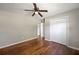 Bedroom with hardwood flooring, a ceiling fan, and a large closet for ample storage at 4861 Alcan Rd, Powder Springs, GA 30127
