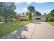 Charming home featuring a well-manicured front yard, a brick walkway, and a long driveway at 4861 Alcan Rd, Powder Springs, GA 30127