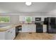 Modern kitchen with stainless steel appliances, and butcher block countertops at 4861 Alcan Rd, Powder Springs, GA 30127