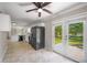 Bright kitchen with black appliances and doors to the backyard at 4861 Alcan Rd, Powder Springs, GA 30127