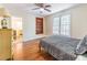 Bedroom featuring a bed, hardwood floors, built in shelving, and a view of the outdoors at 5201 Skyline Dr, Stone Mountain, GA 30083
