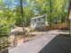 Home with a stone patio and backyard at 5201 Skyline Dr, Stone Mountain, GA 30083