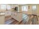 Well-lit kitchen with stainless steel appliances, a central island, and white cabinets at 5201 Skyline Dr, Stone Mountain, GA 30083