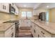 Modern kitchen featuring stainless steel appliances, granite countertops, and white cabinets at 5201 Skyline Dr, Stone Mountain, GA 30083