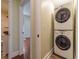 Convenient laundry area featuring a stacked washer and dryer at 5201 Skyline Dr, Stone Mountain, GA 30083