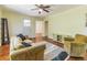 Inviting living room with a comfortable couch, chair, hardwood floors and bright paint at 5201 Skyline Dr, Stone Mountain, GA 30083