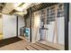 Unfinished basement features exposed ductwork, concrete walls, and a laundry area, ideal for customization at 5272 Cumberland Way, Stone Mountain, GA 30087