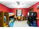 Vibrant bedroom with bunk beds, a desk, a closet, a ceiling fan, shelving, and a window at 5272 Cumberland Way, Stone Mountain, GA 30087