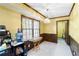 Cozy eating area with yellow walls, wood trim, a large window, and pendant lighting at 5272 Cumberland Way, Stone Mountain, GA 30087