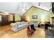 Bright living room with vaulted ceilings, cozy sofas, and hardwood floors at 5272 Cumberland Way, Stone Mountain, GA 30087