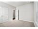 Bedroom with a double-door closet, neutral carpet, and plenty of natural light at 811 Corsiglia Farm, Marietta, GA 30060