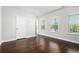 Bright bedroom with hardwood floors, natural light, and a calming neutral color palette that enhances the room's openness at 811 Corsiglia Farm, Marietta, GA 30060