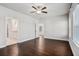 Bedroom with hardwood floors, ceiling fan, and doors leading to a bathroom at 811 Corsiglia Farm, Marietta, GA 30060