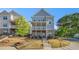 Charming two-story home with a front porch and beautifully landscaped front yard, perfect for curb appeal at 811 Corsiglia Farm, Marietta, GA 30060