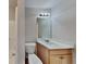 Bathroom features a single vanity, shower with tile surround and toilet at 145 Charleston Pl, Covington, GA 30016