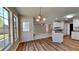 Eat-in kitchen with hardwood floors and windows allowing for plenty of natural light at 145 Charleston Pl, Covington, GA 30016