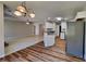 Kitchen seamlessly connects to the living area with an open layout and views to a fireplace at 145 Charleston Pl, Covington, GA 30016