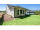 Side view of a home featuring a well-kept lawn and neutral siding at 2013 Ripple Park Bnd, Canton, GA 30114