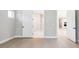 A bright bedroom with light walls, light wood flooring and a window at 2013 Ripple Park Bnd, Canton, GA 30114