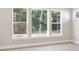 Bright bedroom features hardwood floors and large windows providing backyard views at 2013 Ripple Park Bnd, Canton, GA 30114