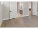 Bedroom with hardwood floors and a view to a bathroom and kitchen at 2013 Ripple Park Bnd, Canton, GA 30114