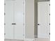 Neutral closet space featuring doors and ample lighting at 2013 Ripple Park Bnd, Canton, GA 30114
