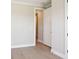 Neutral hallway with wood-style floors and crisp, white trim at 2013 Ripple Park Bnd, Canton, GA 30114