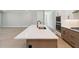 Spacious kitchen island with white countertops, stainless sink, and pendant lighting at 2013 Ripple Park Bnd, Canton, GA 30114