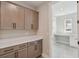 Laundry room with gray cabinets, white countertops, and view to a work area at 2013 Ripple Park Bnd, Canton, GA 30114
