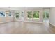 Bright and airy living room with large windows offering lush views of the backyard at 2013 Ripple Park Bnd, Canton, GA 30114