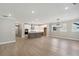 Open-concept living room and kitchen with hardwood floors and modern finishes at 2013 Ripple Park Bnd, Canton, GA 30114