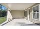 A covered back porch with a concrete floor, natural light, and wooded views at 2013 Ripple Park Bnd, Canton, GA 30114