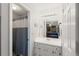 Cozy bathroom adjacent to the main bedroom with a single sink and shower with attractive grey curtain at 2014 Anchor Way, Buford, GA 30518