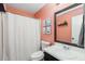 Stylish bathroom featuring a single vanity, toilet and shower with framed mirror and decorative elements at 2014 Anchor Way, Buford, GA 30518