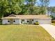 Charming single-story home with stone accents, attached garage, and well-manicured lawn at 2014 Anchor Way, Buford, GA 30518