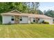 Charming single-story home with stone accents, attached garage, and well-manicured lawn at 2014 Anchor Way, Buford, GA 30518