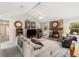Cozy living room showcasing a stone fireplace, vaulted ceilings, and comfortable sectional sofa at 2014 Anchor Way, Buford, GA 30518