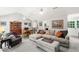 Bright living room with modern furnishings, vaulted ceilings, and an adjacent dining space at 2014 Anchor Way, Buford, GA 30518