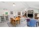 Open-concept living area with a dining set, bar seating, and a comfortable sectional sofa at 2014 Anchor Way, Buford, GA 30518