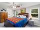 Spacious main bedroom with ensuite bath access, comfy bed, and natural light from nearby windows at 2014 Anchor Way, Buford, GA 30518