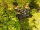 Aerial view of home nestled among lush, mature trees, offering privacy and shade at 400 Collier Rd, Atlanta, GA 30309