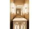 Bright bathroom features a white vanity with mirrored cabinet doors and modern sconces at 400 Collier Rd, Atlanta, GA 30309