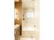 Bathroom boasting marble-like tile, a bathtub, and modern lighting at 400 Collier Rd, Atlanta, GA 30309