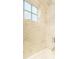 Close-up of bathroom wall featuring marble-like tile and chrome fixtures at 400 Collier Rd, Atlanta, GA 30309