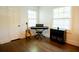 Room showing hardwood floors, an electric piano, a guitar, and storage at 400 Collier Rd, Atlanta, GA 30309
