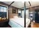Stylish bedroom showcasing a four-poster bed, dark trim, and an open doorway at 400 Collier Rd, Atlanta, GA 30309